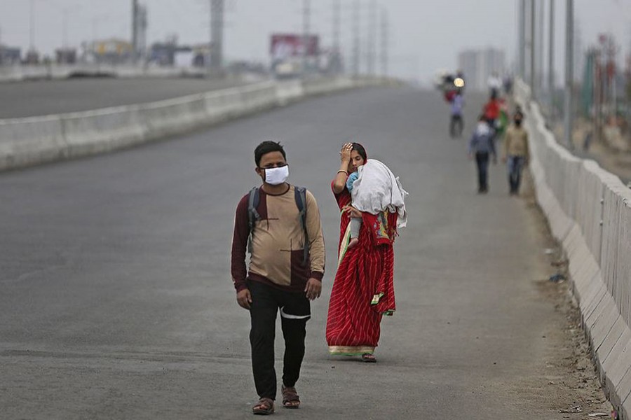 As migrant workers struggle for lockdown aid, India seeks to count them