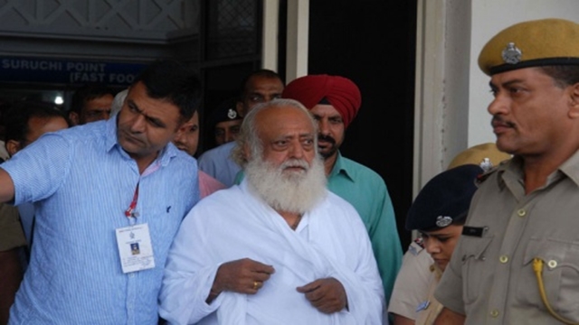 Indian court jails popular guru for life for teen rape